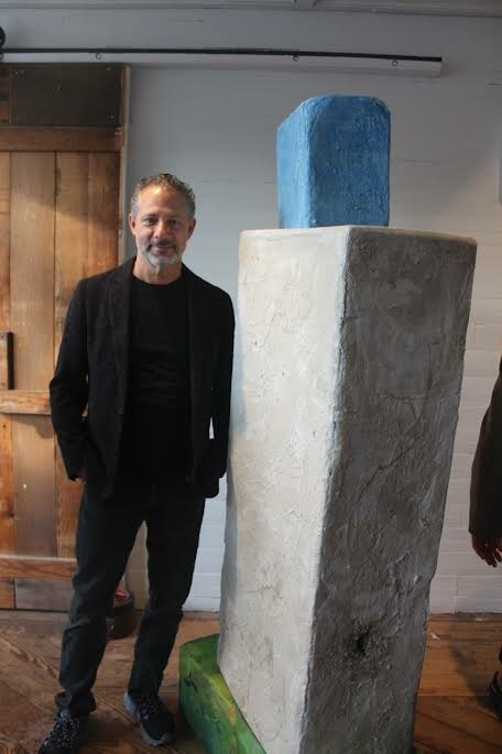 Mark Van Wagner next to his sculpture “Float”
